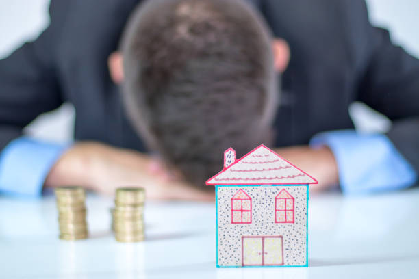 istock man tired of saving money for house 1045537214