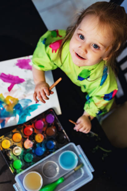istock Girl Painting 1045539524
