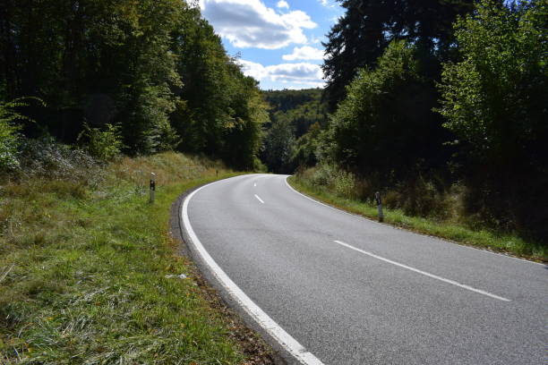 istock autumn road serpentine 1045549920