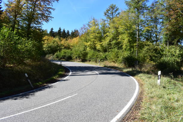 istock autumn road serpentine 1045550976