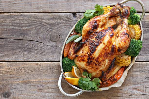 istock Roasted chicken or turkey with vegtables and herbs 1045555134
