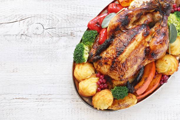 istock Roasted chicken or turkey with vegtables and herbs 1045556068
