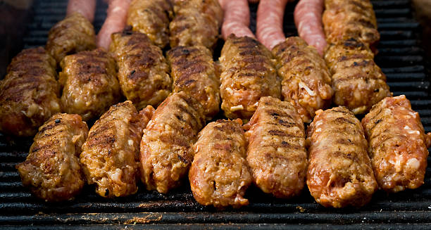 istock Chopped meat and sausages on Barbeque Grill 104556021