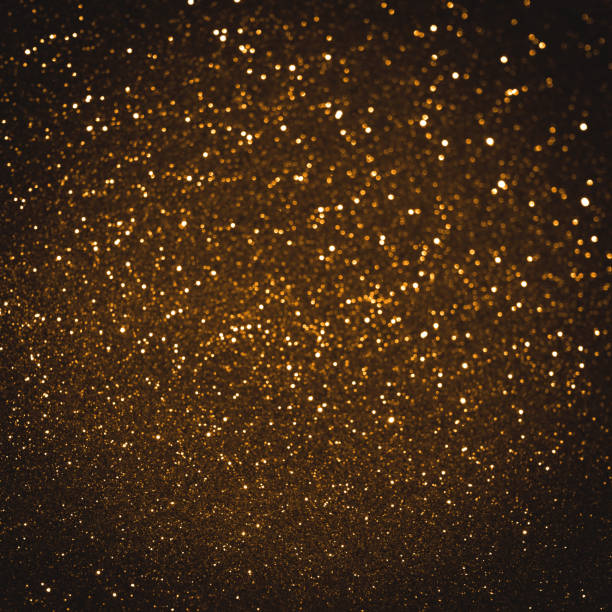 istock Gold background shiny glitter texture brilliant pattern. Beauty crystal abstract for holiday christmas with bokeh light golden. 1045564792