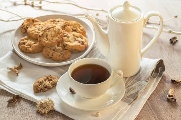 black tee and tasty cookies at breakfast - foods and drinks clothing garment household equipment imagens e fotografias de stock