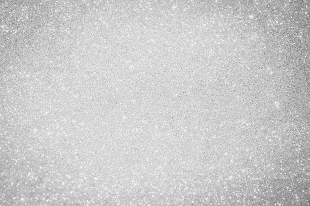 white and silver abstract bokeh lights. defocused background bling blur for christmas