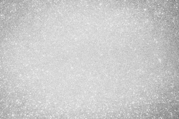 white and silver abstract bokeh lights. defocused background bling blur for christmas white and silver abstract bokeh lights. defocused background bling blur for christmas greeting card white decoration glitter stock pictures, royalty-free photos & images