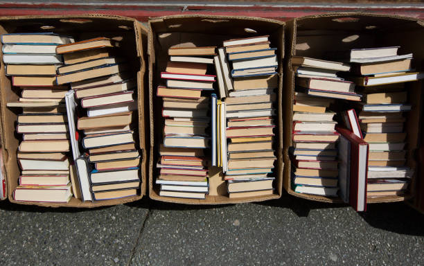 istock books stacked in boxes outdoors 1045570966