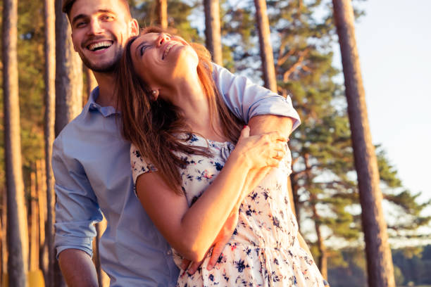 istock Happy couple in love having fun outdoors and smiling 1045574374