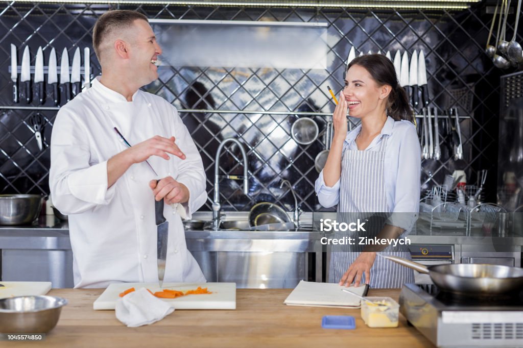 Cook Feeling Highspirited Cooks Laughing In The Kitchen Together Stock Photo ...