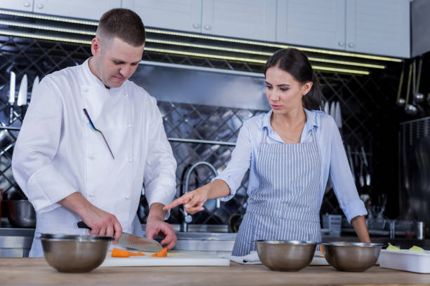 istock Woman and man cooking together in the kitchen 1045580452