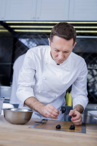 istock Great cook preparing a delicious dinner for the guests 1045580500