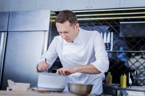istock Busy cook preparing a wonderful dish for the new guests 1045580516