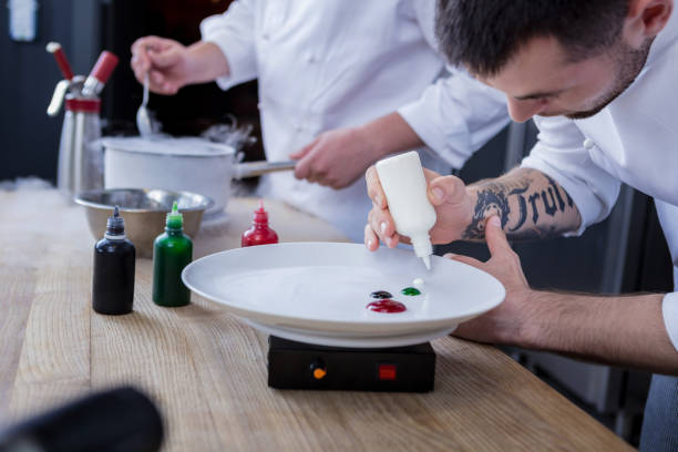 istock Good cooks preparing a delicious dish together 1045580624