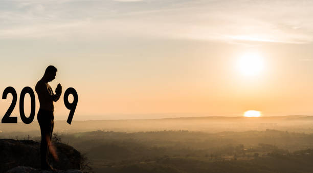 istock Man  practicing yoga during the celebration New Year 2019 1045582850
