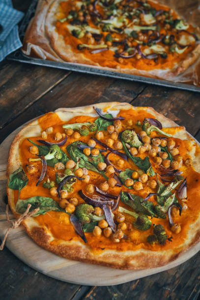 istock Vegan Pumpkin Pizza with Broccoli, Chickpeas and Spinach 1045585290