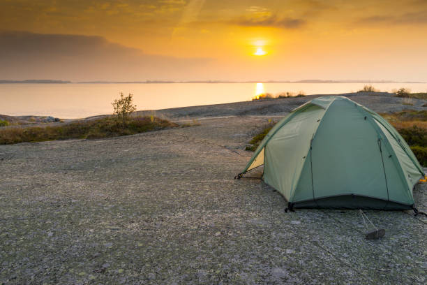 istock Sunrise with a tent in the archipelago 1045591680