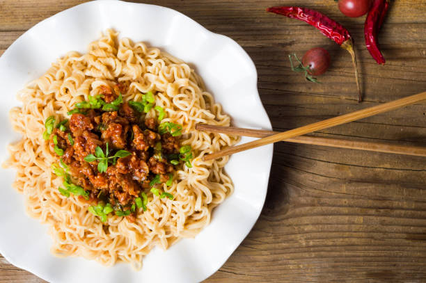 istock Pasta with pork ingredient served on white plate 1045592986