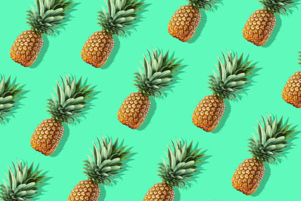 istock Colorful fruit pattern of fresh whole pineapples 1045593034