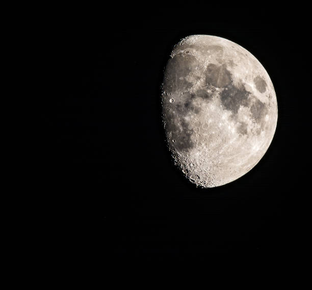 istock rising moon in front of a black sky 1045598630