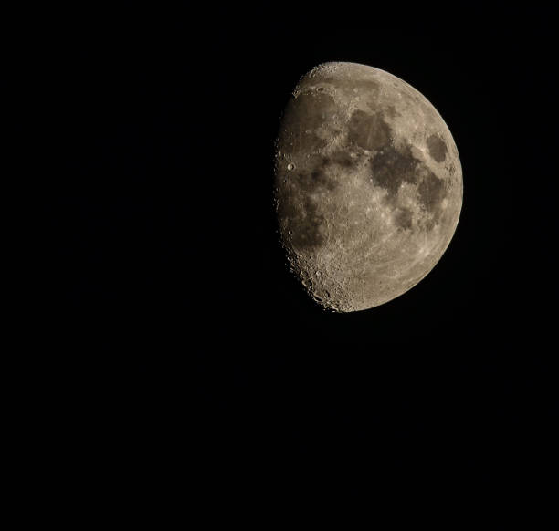 istock rising moon in front of a black sky 1045599260