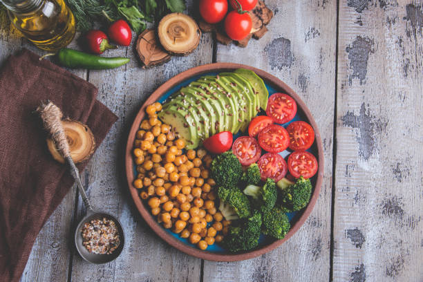 istock Healthy vegan salad with avocado , chickpeas , broccoli , tomato 1045599318