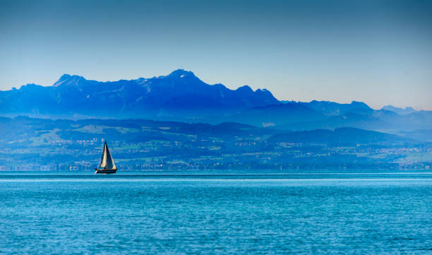 Sailboats and kayakers on Flathead Lake Montana.
