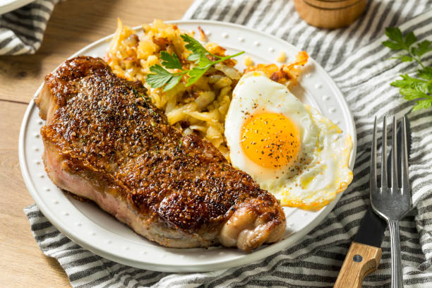 Homemade Steak and Eggs Breakfast Homemade Steak and Eggs Breakfast with Potatoes steak and eggs breakfast stock pictures, royalty-free photos & images