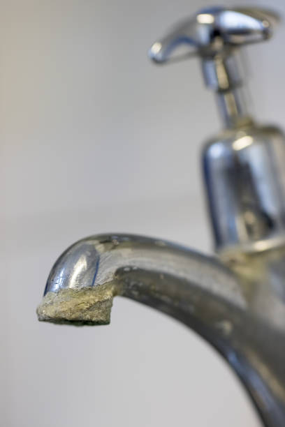 istock Limescale. Hard water calcification of a tap. 1045602866