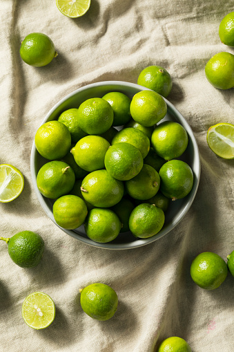 Raw Green Organic Key Limes in a Bowl