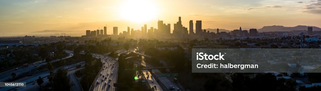 Downtown Los Angeles Skyline at Sunset - Aerial Panorama Aerial panorama of Los Angeles, taken at sunset from above Boyle Heights and looking west over a freeway interchange towards the downtown skyline. City Of Los Angeles Stock Photo