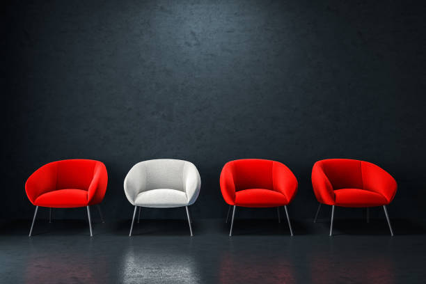 istock White and red armchairs in empty black room 1045626568