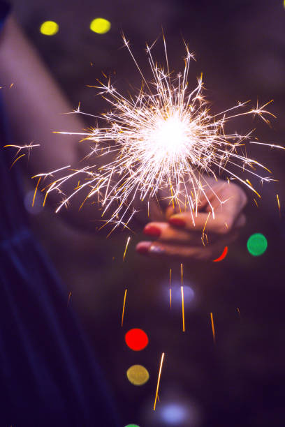 istock girl holds bengal lights 1045627786