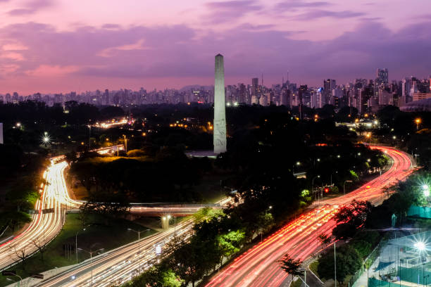 Sao Paulo city at nightfall, Brazil Ibirapuera Park - Obelisk Sao Paulo city at nightfall, Brazil Ibirapuera Park - Obelisk. ibirapuera park stock pictures, royalty-free photos & images