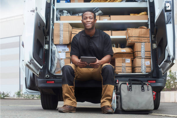 istock Service engineer smiling to camera whilst sat at his van 1045641706