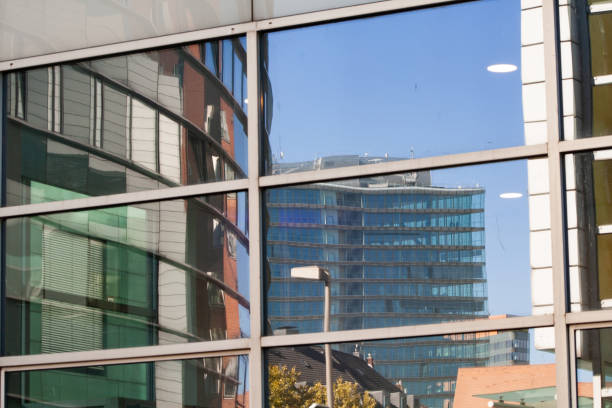 istock Many different office buildings - reflection in the mirror 1045644442