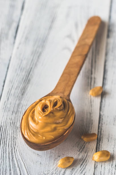 istock Wooden spoon of peanut butter 1045650292