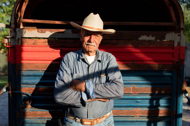istock Senior mexican man standing and crossing arms 1045659272