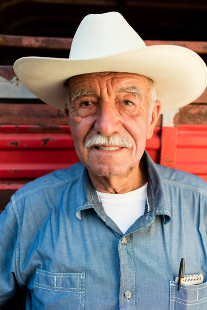 istock Happy senior mexican man wearing a hat and smiling at camera 1045661680