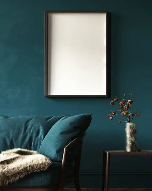 Photo of Mock-up frame in dark green home interior with sofa, fur, table and branch in vase