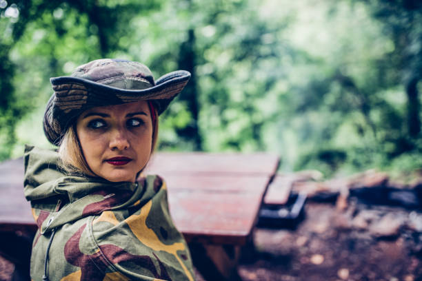 istock Camouflage woman in the forest 1045664962