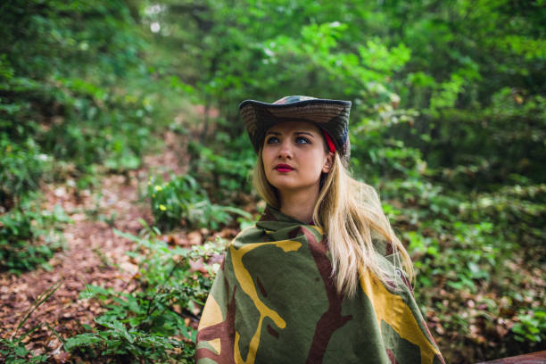 istock Camouflage woman in the forest 1045664984