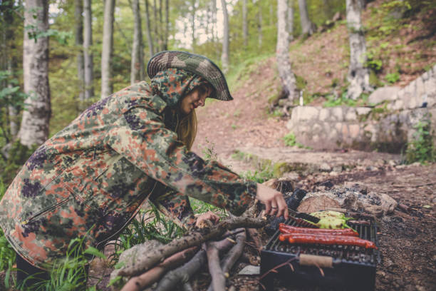 istock Preparing food on grill in forest 1045665068