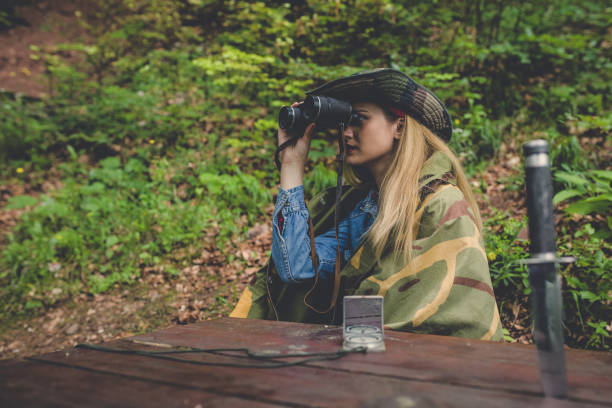 istock Camouflage woman scout in forest 1045671812