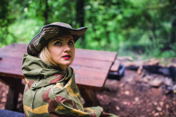 istock Camouflage woman in the forest 1045671846