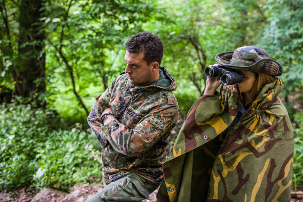 istock Camouflage woman scout in forest 1045671942