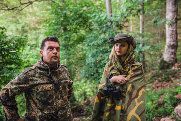istock Camouflage woman scout in forest 1045671950