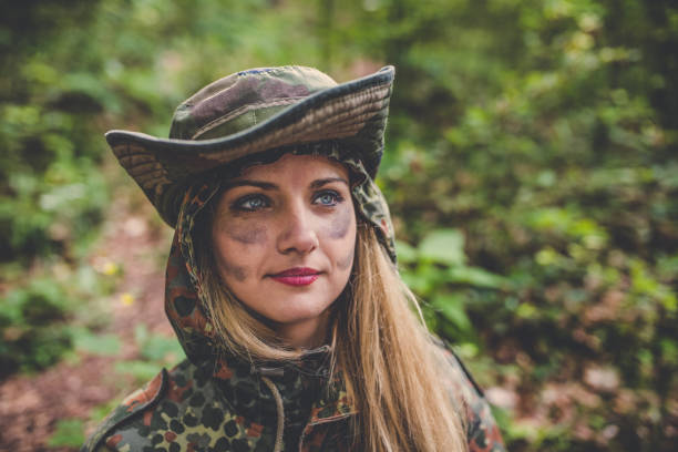 istock Camouflage woman in the forest 1045674014