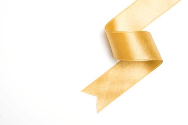 istock Gold ribbon in roll on white background 1045681856