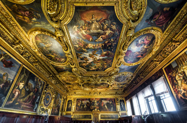 Inside the ornate Doge's Palace or Palazzo Ducale in Venice Venice, Italy - May 20, 2017: Inside the ornate Doge's Palace or Palazzo Ducale. Doge's Palace is one of the main landmarks of Venice. Golden interior of Doge's Palace with luxury painted ceiling. medieval fresco stock pictures, royalty-free photos & images